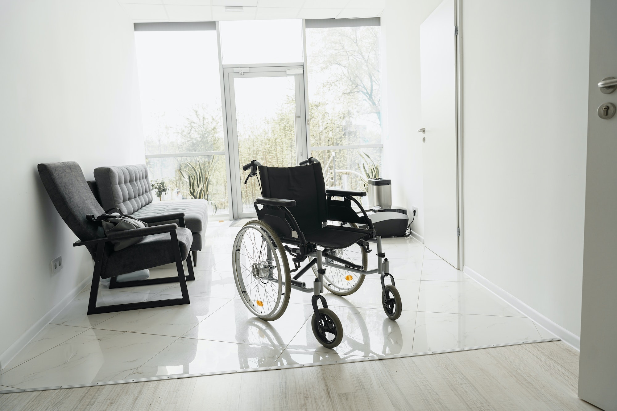 Modern wheelchair in empty hospital hall. Medical equipment