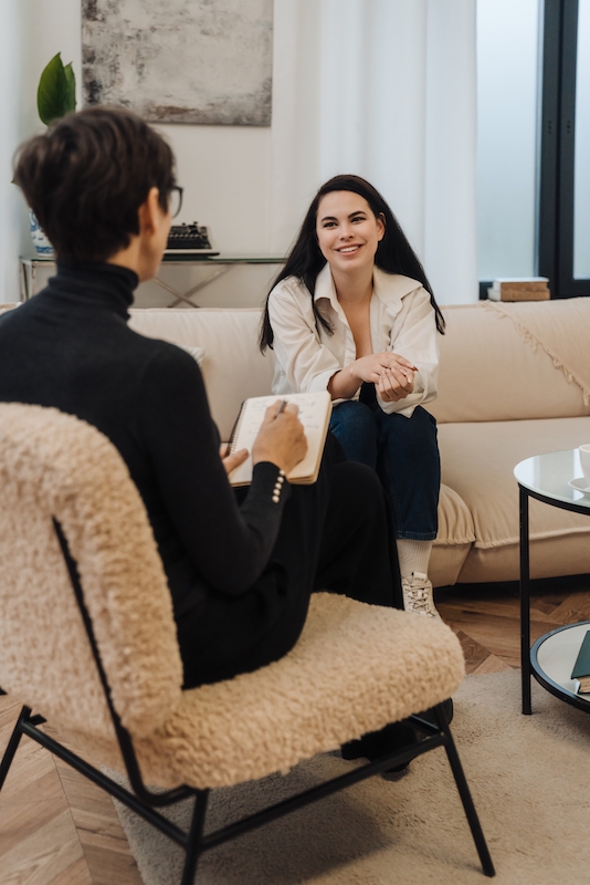 A woman participates in a session of cognitive behavioral therapy for addiction treatment.