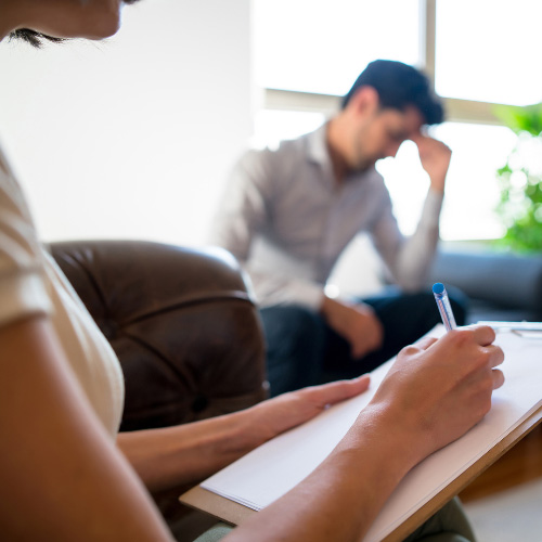 A man participates in DBT therapy for addiction.